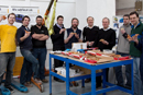 team Microcab celebrating with pizza!