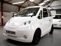 Gregory Barker arrives in the factory after a ride in the new H2EV